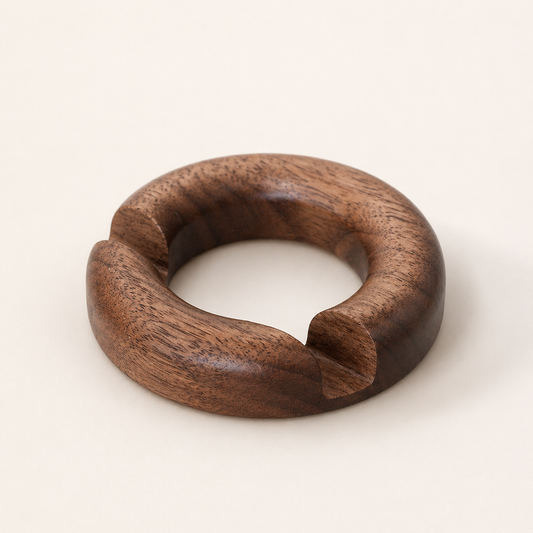 NORVEN round walnut phone stand on a warm minimalist desk